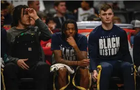  ?? AARON ONTIVEROZ — THE DENVER POST ?? Bones Hyland (3) of the Denver Nuggets sits between Aaron Gordon (50) and Christian Braun (0) during the first quarter against the Golden State Warriors at Ball Arena in Denver on Thursday, Feb. 2, 2023.