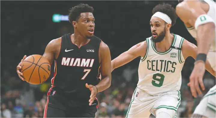  ?? PAUL RUTHERFORD/USA TODAY SPORTS FILES ?? Miami Heat guard Kyle Lowry looks to move the ball against Boston Celtics guard Derrick White during Game 4 on Monday at TD Garden.