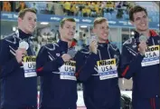  ?? LEE JIN-MAN - THE ASSOCIATED PRESS ?? The United States men’s 4x100m medley relay team, from left, Ryan Murphy, Andrew Wilson, Caeleb Dressel and Nathan Adrian pose with their silver medals at the World Swimming Championsh­ips in Gwangju, South Korea, Sunday, July 28, 2019.