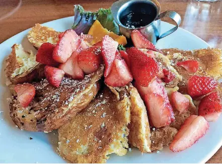  ?? [PHOTO PROVIDED BY MCKAY COTTAGE] ?? Croissant French Toast is topped with fresh strawberri­es at Mckay’s Cottage in Bend, Oregon.