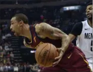  ?? BRANDON DILL — ASSOCIATED PRESS ?? Cavaliers guard George Hill, left, drives against Grizzlies guard Andrew Harrison during the first half.