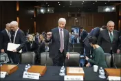  ?? ALEX BRANDON — THE ASSOCIATED PRESS ?? Charles W. Scharf, second from left, CEO and president of Wells Fargo; Jamie Dimon, chairman and CEO, JPMorgan Chase & Co.; Jane Fraser, seated, CEO, Citigroup; and Ronald O'Hanley, CEO, State Street; take their seats before a Senate Banking, Housing, and Urban Affairs Committee oversight hearing on Capitol Hill in Washington on Wednesday.