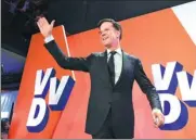  ?? JOHN THYS / AFP ?? Netherland­s prime minister and VVD party leader Mark Rutte celebrates in The Hague on Wednesday after exit polls showed his party winning the general elections.