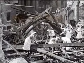  ??  ?? Blitz: Nurses search the rubble of the London Chest Hospital, Victoria Park