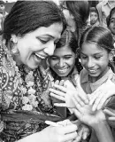  ??  ?? BUILDING AN EQUITABLE CLIMATE Girl Rising Country Representa­tive Nidhi Dubey with students from the “School Campaign”