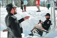  ?? REUTERS ?? A policeman stands guard at the base of the chairlift to the ski resort in Malam Jabba, Pakistan. The country has seen a growing number of domestic tourists.