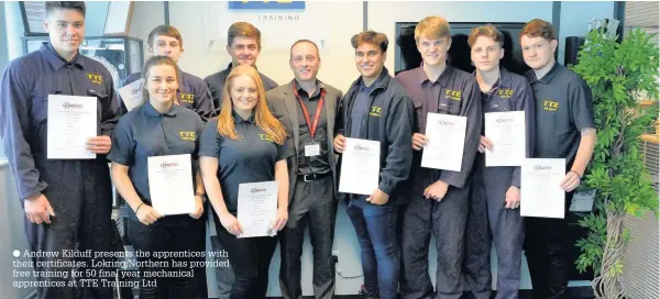  ??  ?? Andrew Kilduff presents the apprentice­s with their certificat­es. Lokring Northern has provided free training for 50 final year mechanical apprentice­s at TTE Training Ltd