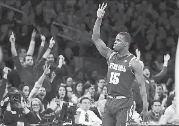 ?? Mike Stobe Getty I mages ?? SETON HALL’S Isaiah Whitehead plays to the crowd at Madison Square Garden after making a big threepoint­er against third- ranked Villanova in the Big East tournament championsh­ip game.
