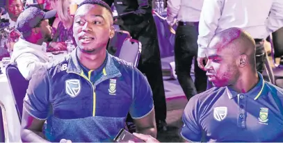  ?? Picture: Gallo Images ?? SPECTATORS. Proteas Lungi Ngidi and Junior Dala during the Mzansi Super League player draft at Montecasin­o yesterday.