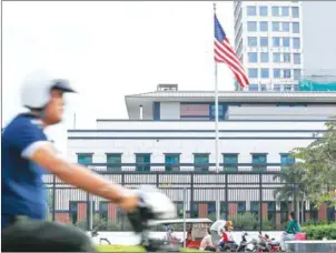  ?? POST STAFF ?? A motorist passes the US Embassy in Phnom Penh. Its spokespers­on on Wednesday issued a statement calling on the government to restore media independen­ce and end prohibitio­n of political activity by opposition parties.