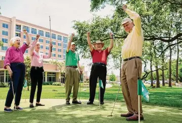  ?? Courtesy of Brazos Towers at Bayou Manor ?? Fun on the putting course is just one of the many activities that residents enjoy — others include cornhole, birdwatchi­ng, community gardening, or simply walking the beautiful trails with their pets.