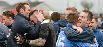  ??  ?? North End United players celebrate their penalty shoot-out success in Limerick.