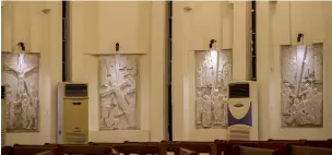  ?? AFP ?? four of the 14 pieces of The Way of Suffering’ sculpted plaques are displayed at the Chaldean Catholic Church of the ascension in the mashtal district of the capital Baghdad. —