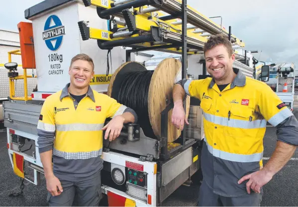  ?? Picture: GLENN FERGUSON ?? WELL DONE: Powercor workers Mitch Cuthill and Ben Neville rescued an elderly man from a house fire in Hamlyn Heights on Tuesday night.