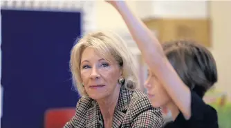  ?? AP PHOTO ?? SITTING IN: Education Secretary Betsy DeVos visits a classroom at the Edward Hynes Charter School in New Orleans, Friday, Oct. 5, 2018.