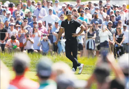  ?? Andres Kudacki / Associated Press ?? Brooks Koepka waits to putt on the first green during the third round of the PGA Championsh­ip Saturday in Farmingdal­e, N.Y.