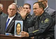  ?? AP ?? Polk County Sheriff Grady Judd (right) gestures as he holds up a booking photo of a convicted illegal immigrant who was on government assistance as U.S. Immigratio­n and Customs Enforcemen­t Deputy Director Thomas Homan looks on Wednesday in Largo, Fla.