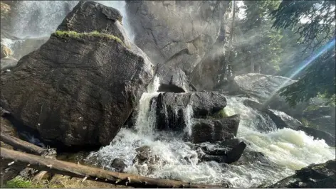  ?? PHOTOS BY WENDY RIGBY — ESTES PARK TRAIL-GAZETTE ?? Sun streaming through the waterfall mist created surprising rainbows below Ouzel Falls.