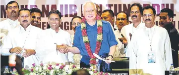  ??  ?? Najib shakes hands with Dr Subramania­m after launching the 71st MIC General Assembly at the Putra World Trade Centre. — Bernama photo