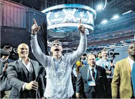 ?? BOB DONNAN USA TODAY Sports ?? Connecticu­t Huskies head coach Dan Hurley celebrates after walking off the court after defeating the San Diego State Aztecs in the national championsh­ip game of the 2023 NCAA Tournament at NRG Stadium in Houston on April 3, 2023.