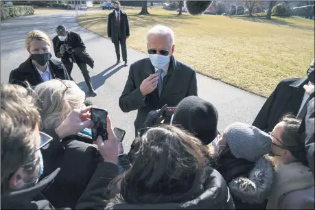  ?? EVAN VUCCI — THE ASSOCIATED PRESS ?? President Joe Biden talks with reporters after arriving on the South Lawn of the White House Feb. 8 in Washington.