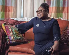  ??  ?? Carrie Barrett sits for a portrait at her home in Memphis on June 23. ANDREA MORALES/MLK50