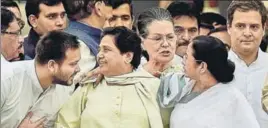  ?? PTI FILE ?? BSP president Mayawati, flanked by West Bengal chief minister Mamta Banerjee and RJD leader Tejashwi Yadav, at the swearingin of Karnataka chief minister HD Kumaraswam­y. Congress leaders Sonia Gandhi and Rahul Gandhi can be seen behind them.