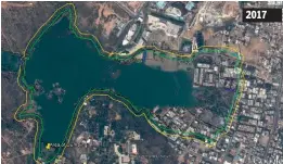  ??  ?? The yellow marking on the google image taken in 2017 indicates the buffer zone of the lake, while the green indicates the Full Tank Level (FTL). According to law, one cannot build either in the buffer zone of the FTL zone. However, there are a number...