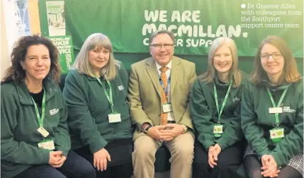  ??  ?? Dr Graeme Allan with colleagues from the Southport support centre team