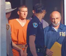  ?? JOHN GAPS III/ASSOCIATED PRESS ?? Timothy McVeigh is led out of the Noble County Courthouse in Perry, Okla., on April 21, 1995, after being identified as a suspect in the bombing of the Oklahoma City Federal Building.