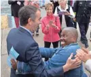  ??  ?? Democratic gubernator­ial candidate Lt. Gov. Ralph Northam gets a hug from a supporter after voting in Norfolk, Va., on Tuesday. Northam faced Republican Ed Gillespie in the race for governor. STEVE HELBER/AP