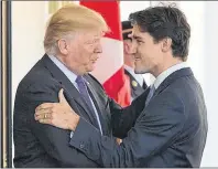  ?? CP PHOTO ?? U.S. President Donald Trump, left, greets Canadian Prime Minister Justin Trudeau during a visit to the White House earlier this year.