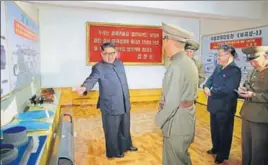  ??  ?? Undated photo released on August 23 shows Kim JongUn at the Chemical Material Institute of the Academy of Defence Science at an undisclose­d location in North Korea.