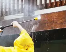  ?? ISTOCK ?? Power washing a deck gets rid of the dirt and film accumulate­d over a long winter. For a polished look, follow up with a good stain.