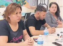  ?? ANGELA KOCHERGA/JOURNAL ?? A mother from El Salvador and a father from Honduras are among hundreds of parents waiting to be reunited with their children. Taylor Levy, far right, legal coordinato­r for Annunciati­on House in El Paso, said the two have not been able to get their kids back.