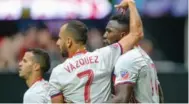  ?? RICH VON BIBERSTEIN/ICON SPORTSWIRE VIA GETTY IMAGES ?? An Atlanta fan tossed beer at Toronto’s Jozy Altidore, right, when he scored an equalizing goal Sunday.