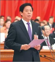  ?? RAO AIMIN / XINHUA ?? Li Zhanshu, chairman of the 13th National People’s Congress Standing Committee, addresses the closing meeting of the first session of the 13th NPC on Tuesday.