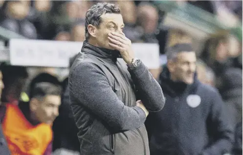  ??  ?? 0 Hibs boss Jack Ross looks on during his side’s derby defeat by Hearts which he says hurt, even if he doesn’t always show it.