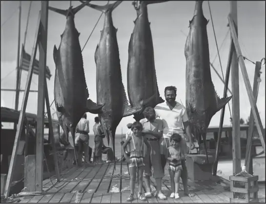  ?? PHOTOS: PBS ?? A fan of deep-sea fishing, Ernest Hemingway poses with his three sons (from left, Patrick, Jack and Gregory) in the Bahamas on July 20, 1935.