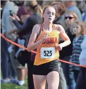  ?? RICK WOOD / MILWAUKEE JOURNAL SENTINEL ?? DSHA's Meghan Scott approaches the finish line to place first in a sectional cross-country meet Saturday at Lincoln Park.