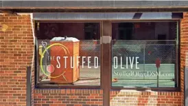  ?? ?? The Stuffed Olive moves “200 steps” from its location on Third Street to Court Avenue in downtown Des Moines.