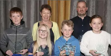  ??  ?? The Murrintown NS team who were winners of the U-11 section at the Enniscorth­y Credit Union Schools Quiz in the Riverside Park Hotel. Front: Finn Stafford, Jenna Ryan, Joe Radford and Sile Roe. Back: Frances Cross (ECU) and Fintan Whyte (acting principal).