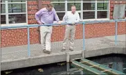  ?? Doug Walker, File ?? Rome Water and Sewer Division Assistant Director John Boyd (left) and Director Mike Hackett check out the sedimentat­ion basins at the Rome water filtration plant in this May 29, 2016, file photo.