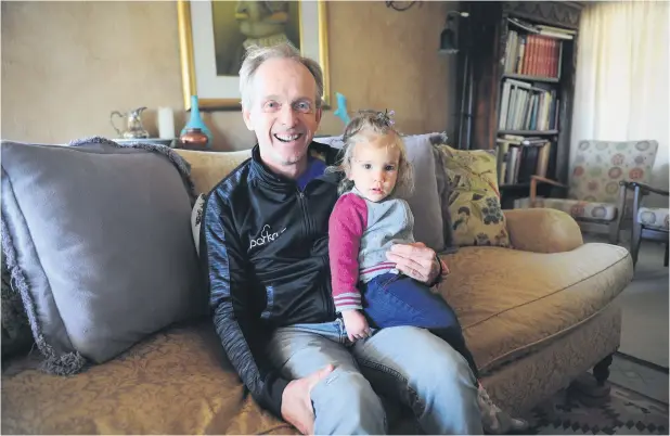  ?? Picture: Michel Bega ?? GENERATION­S. Comrades legend Bruce Fordyce relaxes at home with his granddaugh­ter, Amy Fordyce-Robinson.