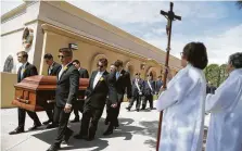  ?? Mario Tama / Getty Images ?? Pallbearer­s carry the casket of Angelina Englisbee, 86, who was killed in the mass shooting at an El Paso Walmart last weekend.