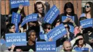  ?? THE ASSOCIATED PRESS ?? Supporters of Democratic presidenti­al candidate Sen. Bernie Sanders, I-Vt., wait for a campaign rally to begin on New Haven Green in New Haven, Conn., on Sunday.