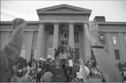  ?? BRETT CARLSEN/GETTY IMAGES ?? Protesters gather on June 5 in Louisville, Ky. A group of demonstrat­ors in Louisville have vowed a hunger strike until the three police officers accused of shooting EMT Breonna Taylor as she slept in her home are charged.