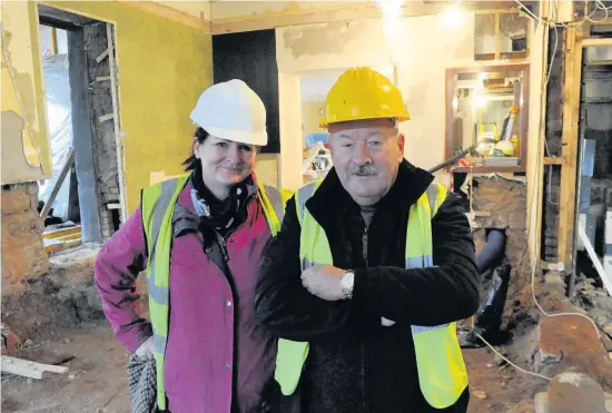  ??  ?? Grand designs Siobhan Edwards with her dad Harry Hood as the restoratio­n works gets underway in the public bar area of Angels Hotel