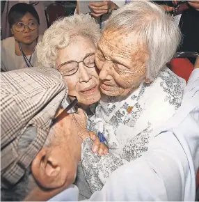  ?? AP ?? South Korean Cho Hye-do, 86, center, hugs her North Korean sister Cho Sun Do, 89, right, during the Separated Family Reunion Meeting at the Diamond Mountain resort in North Korea on Monday.