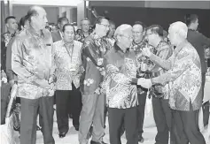  ??  ?? Masing (front second right) arrives at the BIMP-EAGA gala dinner together with Liow (behind Masing).